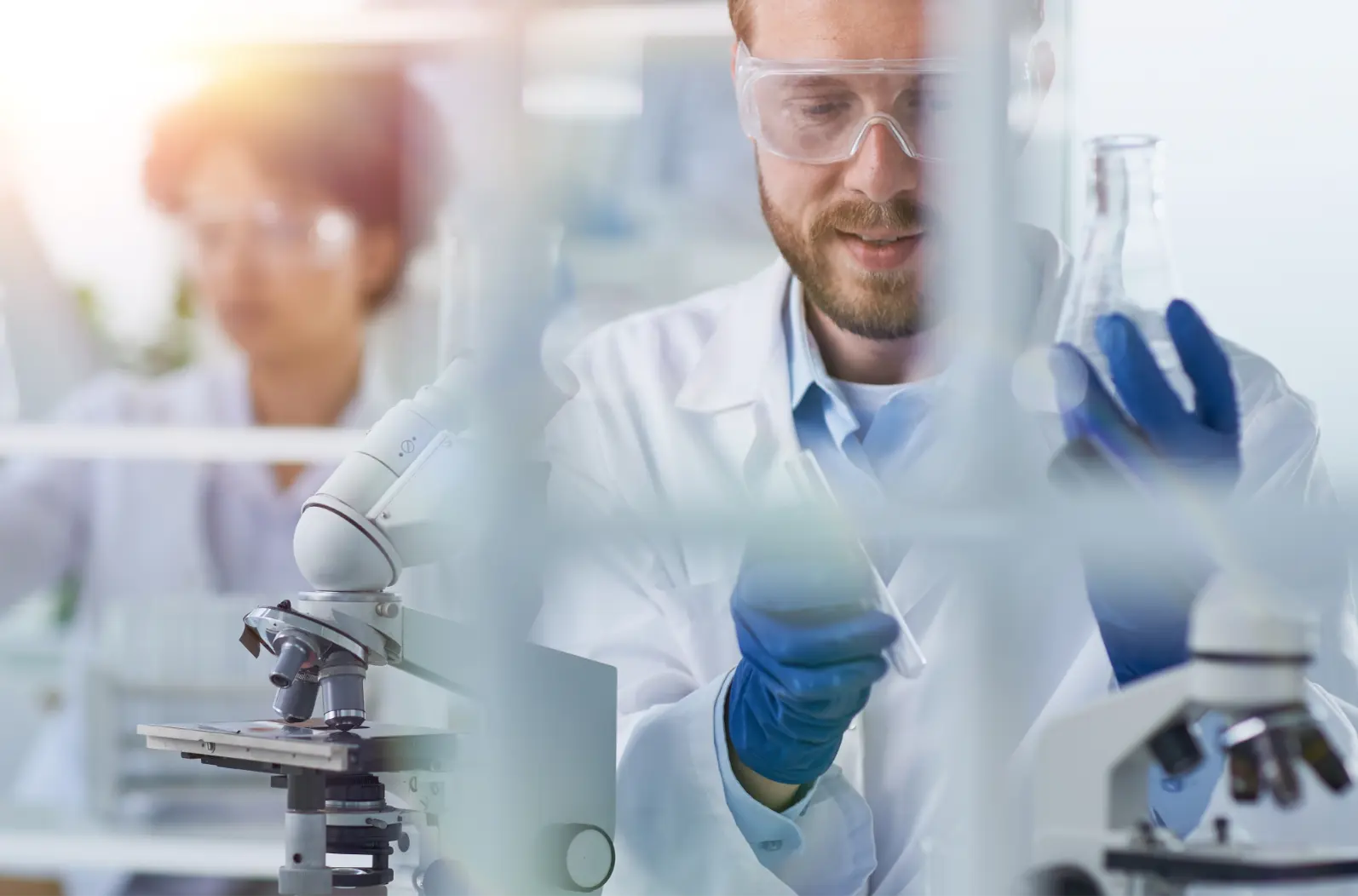 Analytical Validation block image | Scientist holding beaker